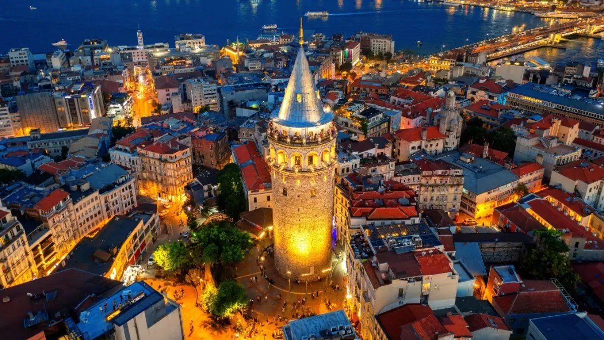 Galata Tower above the rooftops of Istanbul at dusk